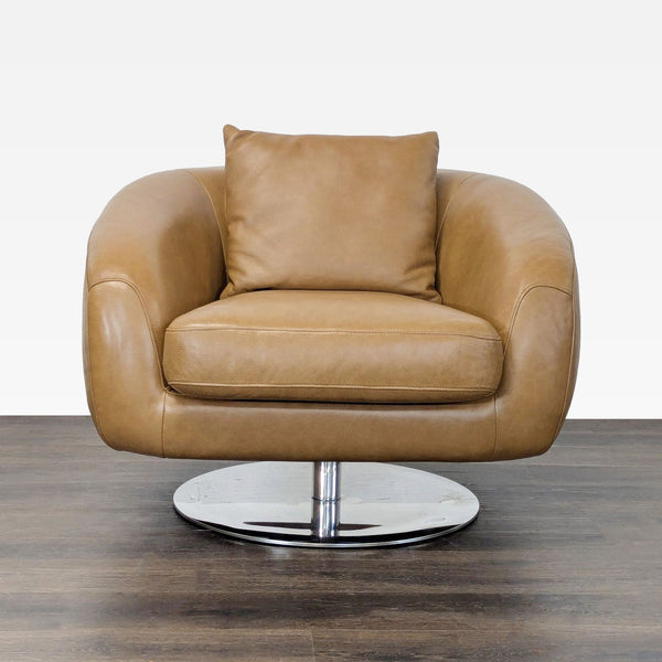 Modern tan leather lounge chair by Castlery with rounded design and chrome swivel base for living rooms.  