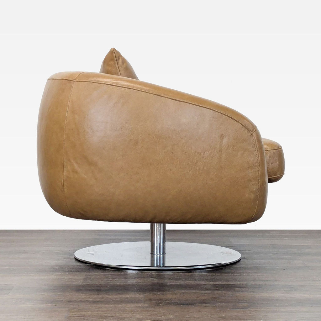 Contemporary lounge chair by Castlery, tan leather upholstery, plush support, and swivel chrome base.