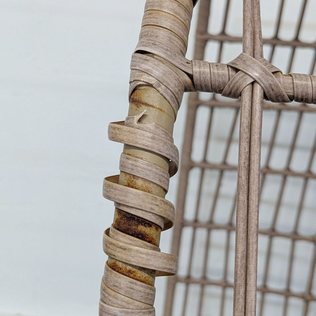 Unique open-weave egg chair with supportive seat and metal legs, ideal for lounging or reading indoors or out.