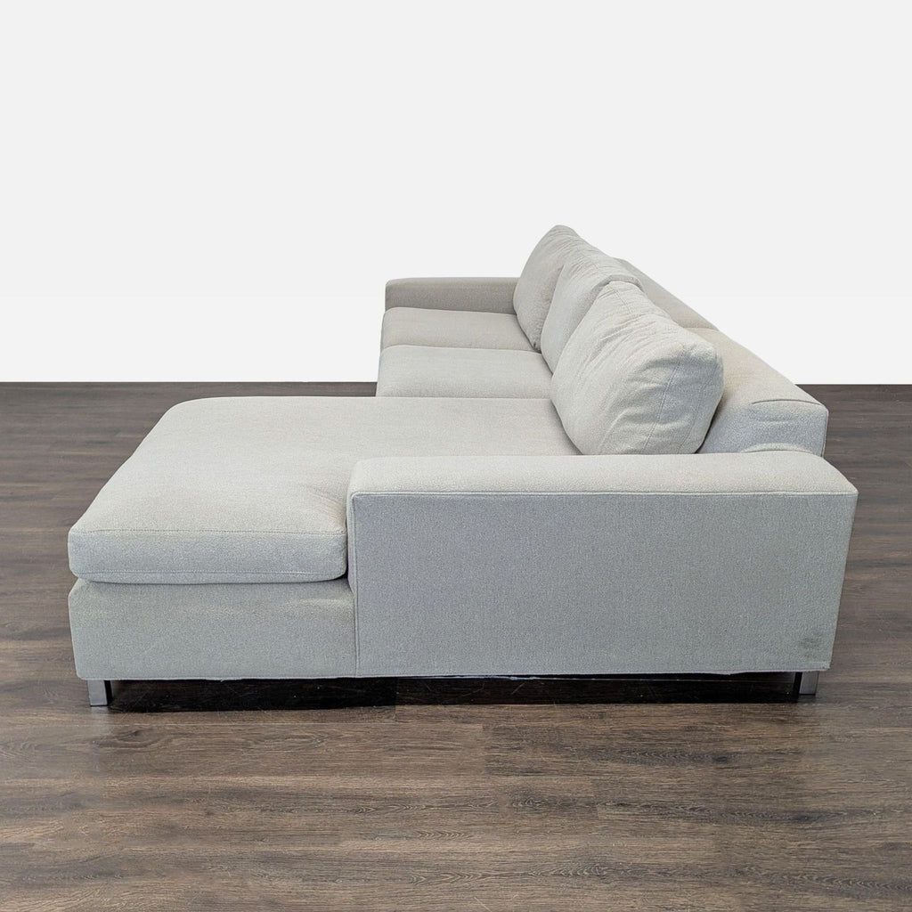 Room & Board light-colored sectional, clean design with spacious chaise, perfect for stylish living rooms.