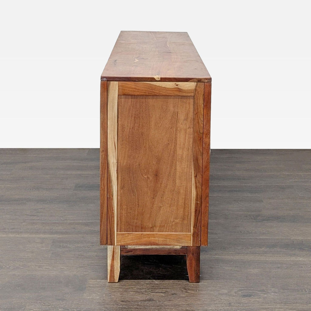 Ashley carved wood credenza, three doors with decorative detail and internal shelves, for sideboard and storage use.