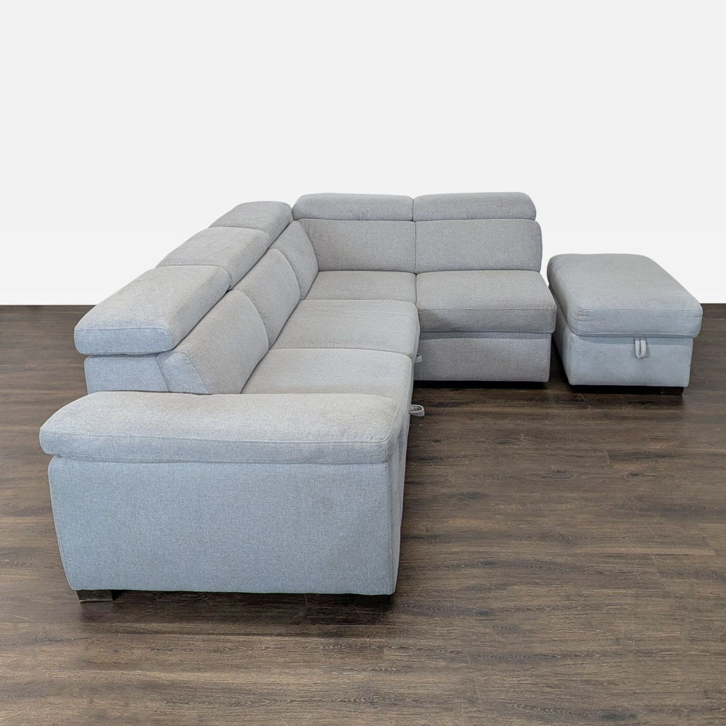 Versatile sleeper sofa with chaise, providing storage and a pull-out bed in a sleek, minimalist design.
