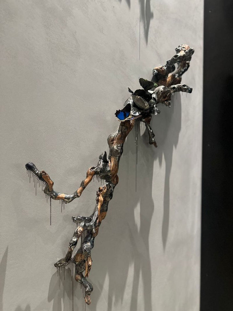 1. Closeup view of a Jocelyn Marsh wall sculpture, showing intricate textures and metallic details.  