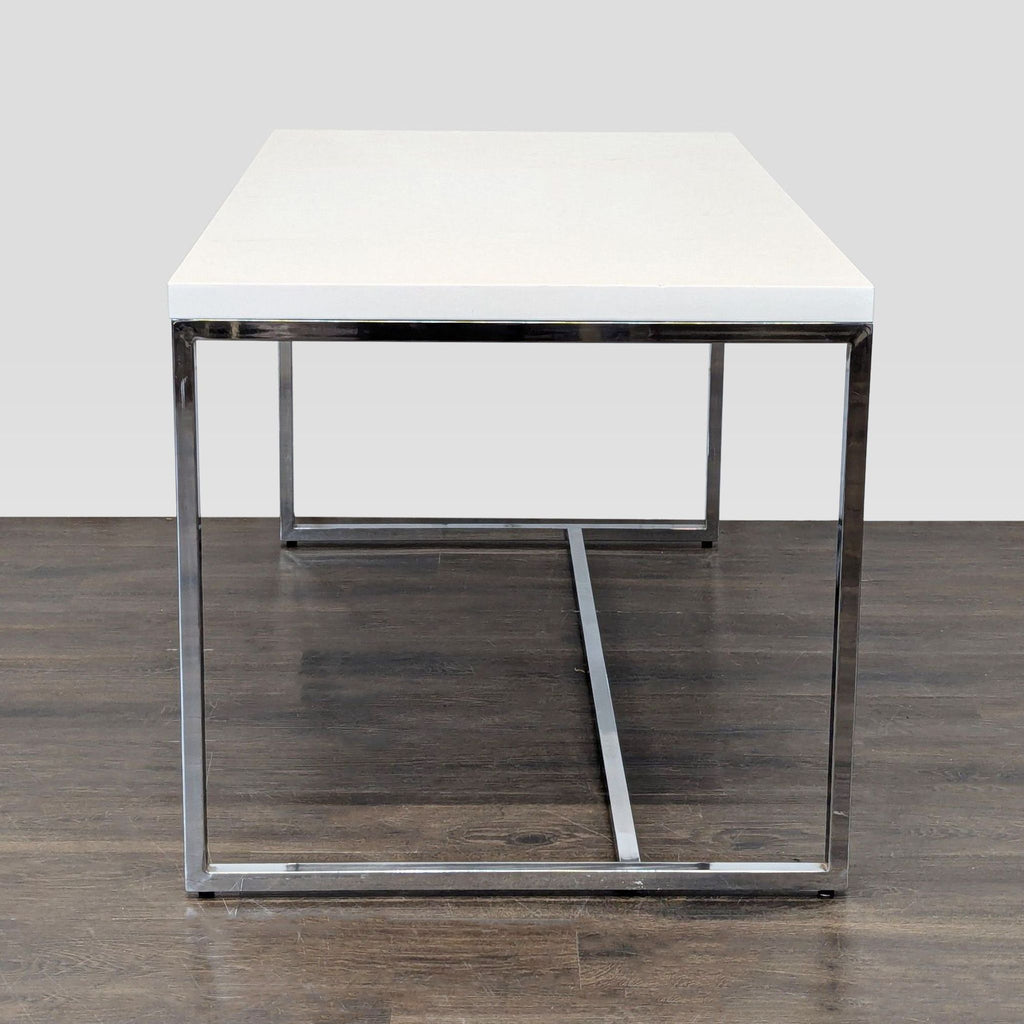 Contemporary Scandinavian Design desk featuring a clean white surface and sturdy chrome metal frame.