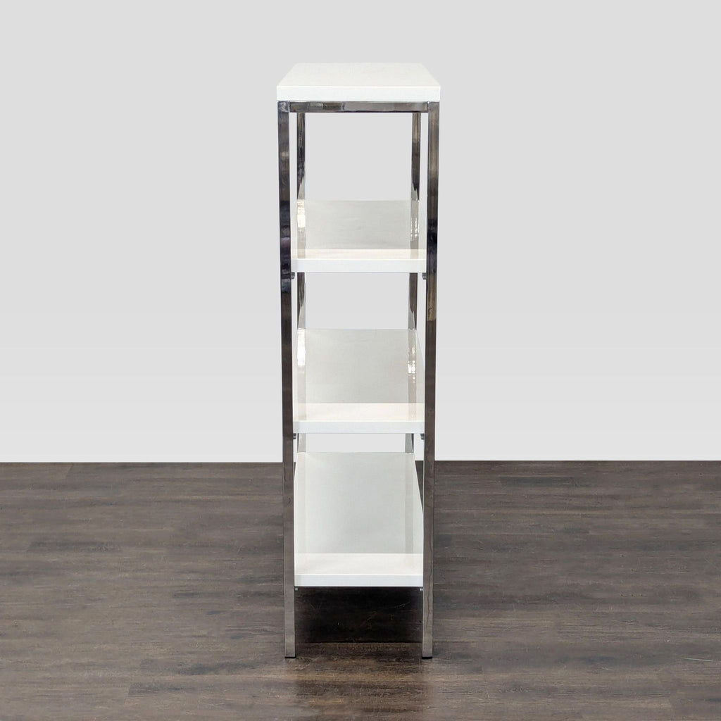 Scandinavian Design bookshelf featuring a minimalist chrome frame and four white shelves for versatile storage.