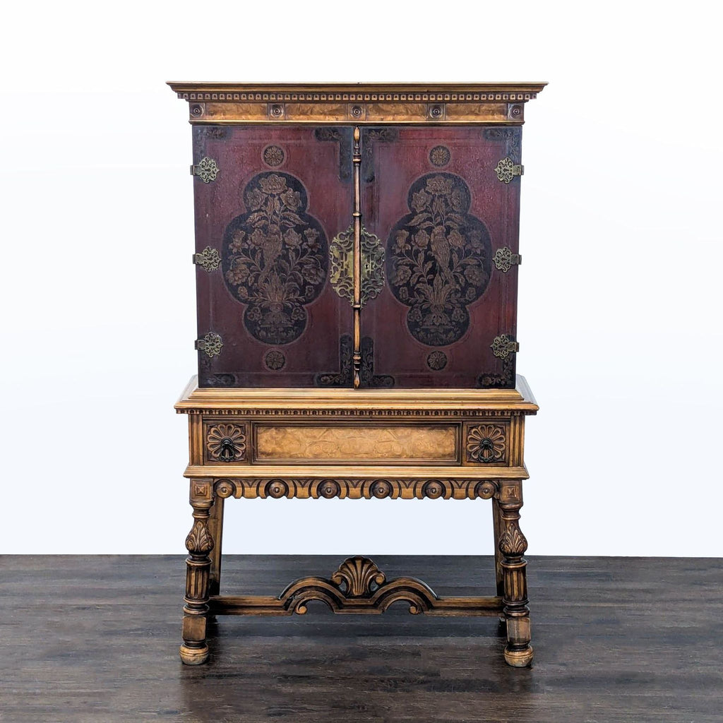 Early 20th century Berkey & Gay cabinet with painted floral doors, burled wood, and brass hardware.