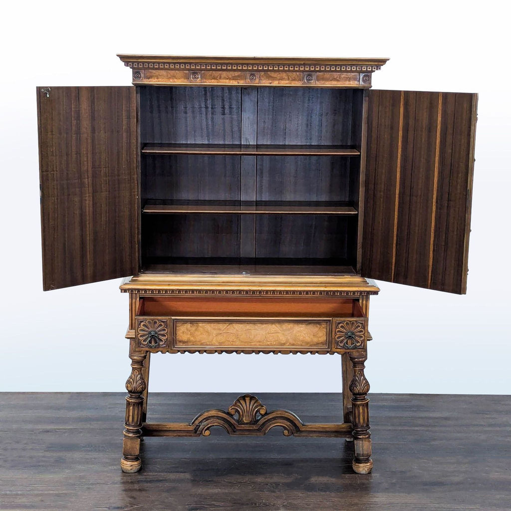 Vintage cabinet by Berkey & Gay featuring flower and bird motifs, interior shelves, drawer, and carved base.