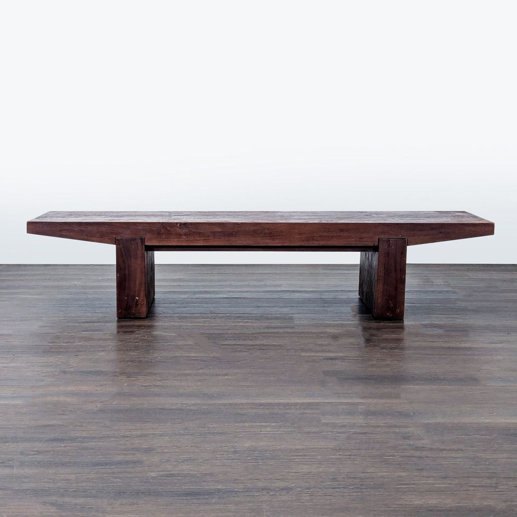 West Elm solid acacia wood table, featuring sturdy legs with adjustable levelers for uneven floors.  