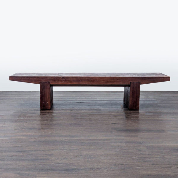 West Elm solid acacia wood table, featuring sturdy legs with adjustable levelers for uneven floors.  