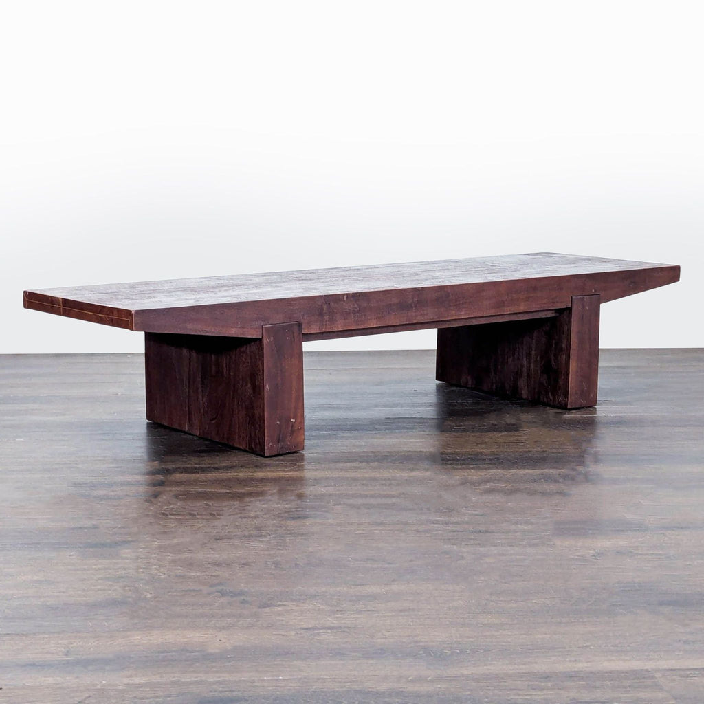 Modern West Elm acacia wood furniture, with adjustable leg levelers for stability on all floor types.