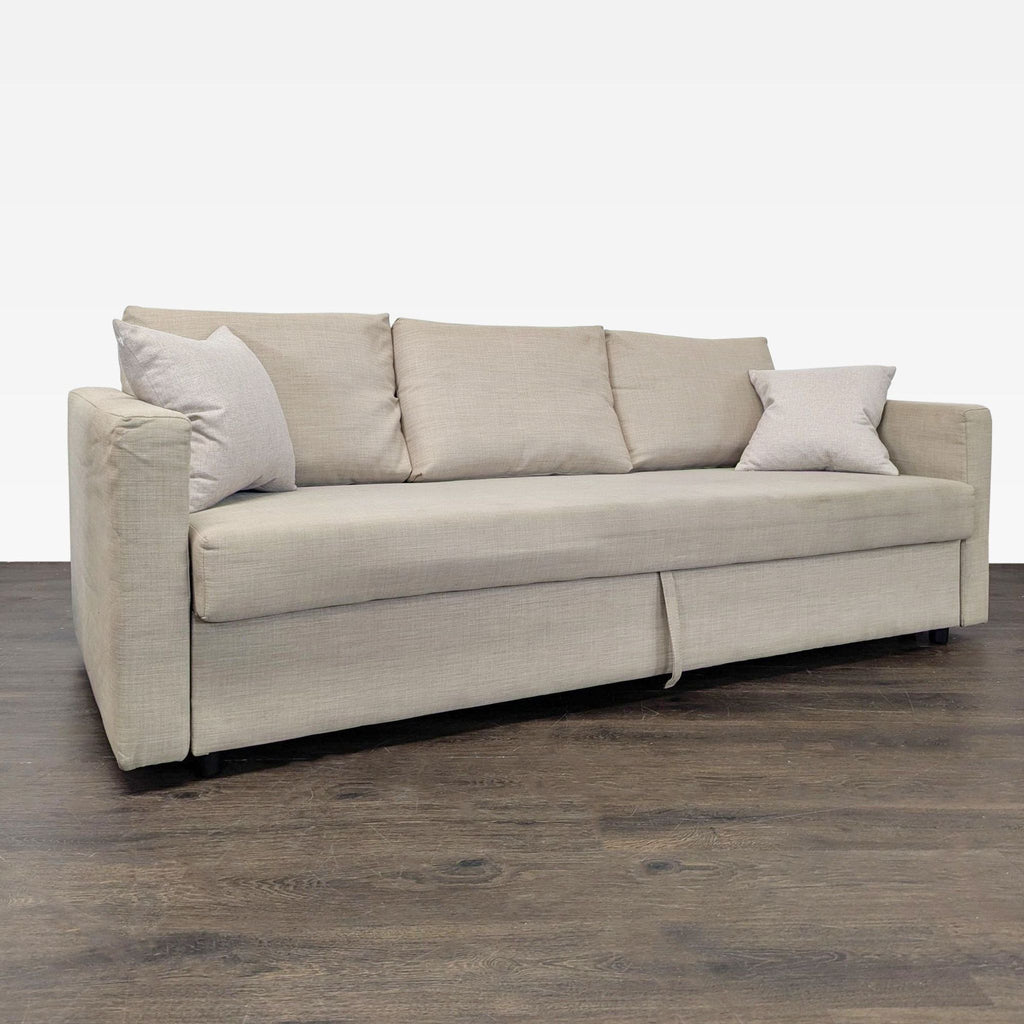 Ikea sleeper sofa in beige, ideal for small spaces, offering comfort, sturdy design, and simple style.