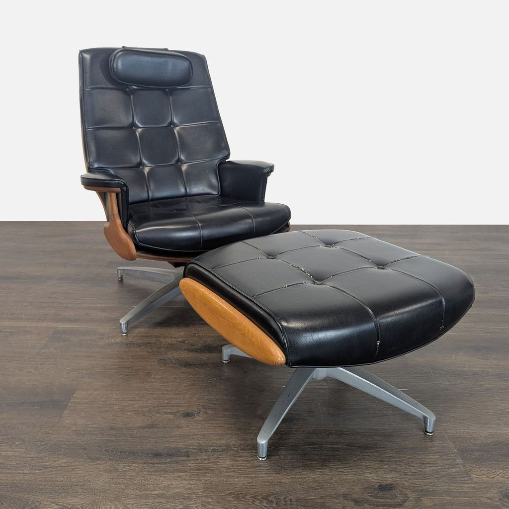 Heywood-Wakefield black leather lounge chair and ottoman with tufting and wood accents, on metal swivel bases.