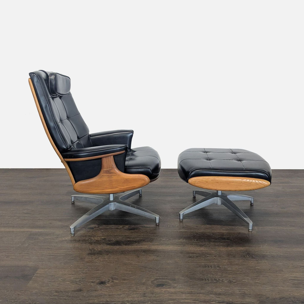 Mid-century modern Heywood-Wakefield chair and ottoman set in black leather, featuring tufted cushions and wood trim.