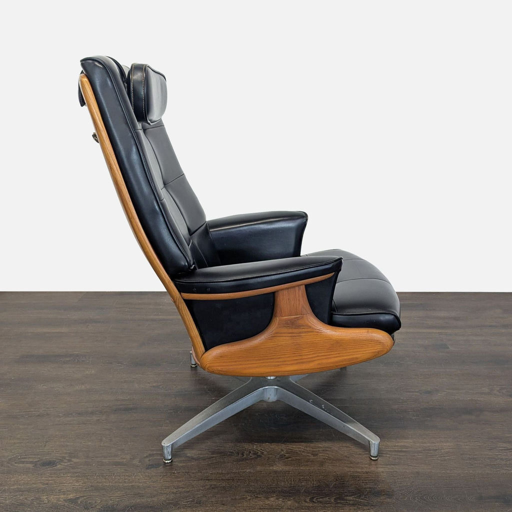 Sleek Heywood-Wakefield lounge chair and ottoman set with black leather, button tufting, and metal swivel bases.