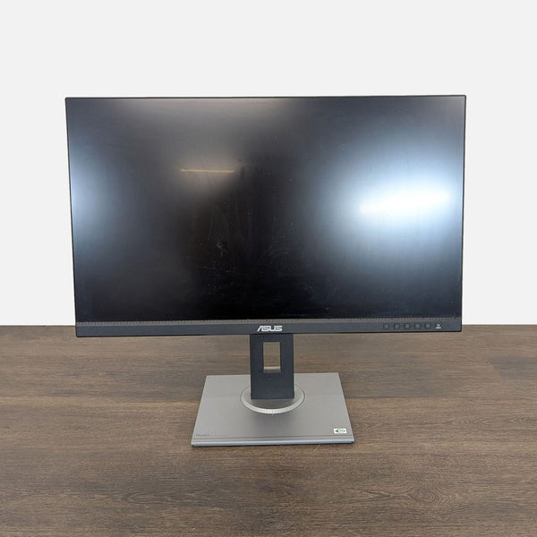 Front view of Asus ProArt 24-inch monitor with slim bezels and adjustable stand, ideal for work or creative tasks.
