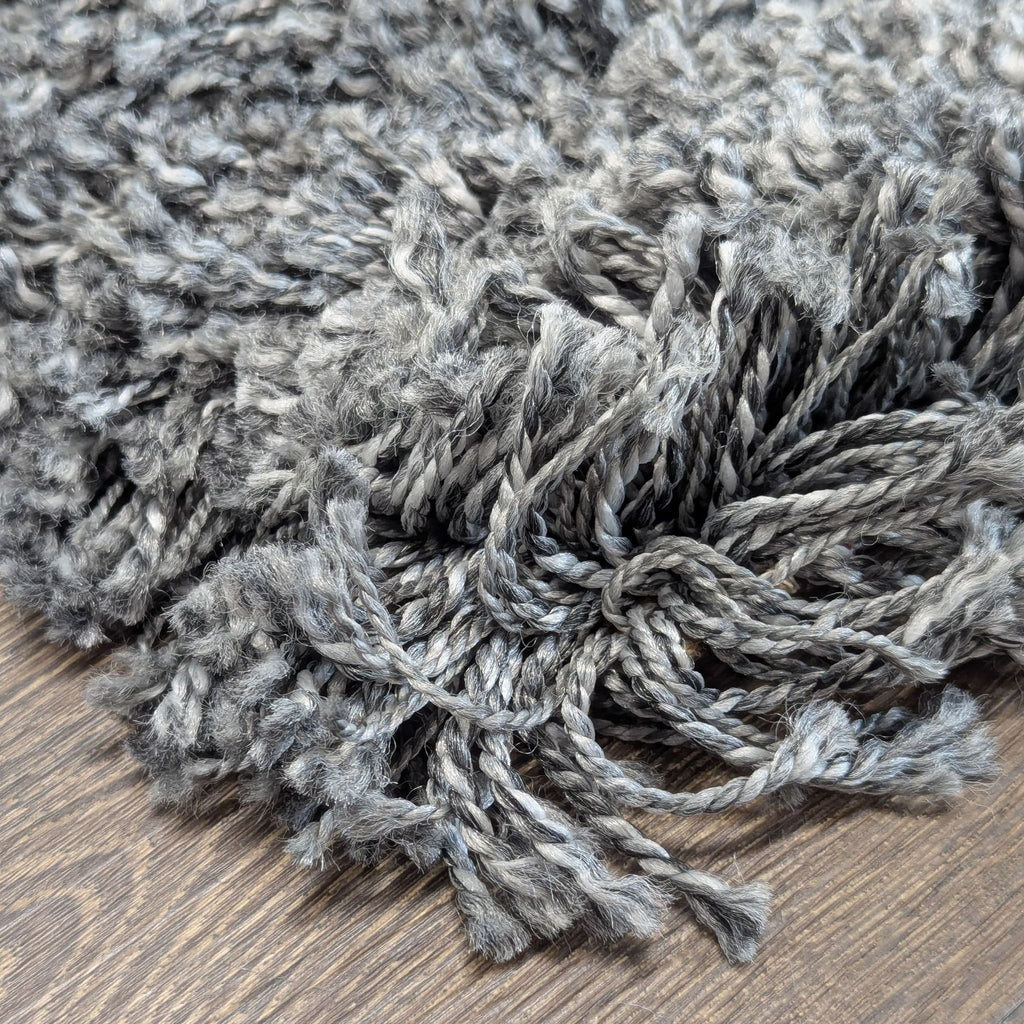 Contemporary gray IKEA rug with a cozy, high-pile surface and non-slip backing for warmth and comfort.