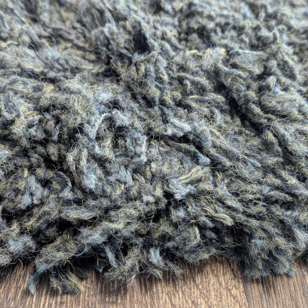 Shaggy area rug in warm brown, featuring a durable, soft surface that complements any room décor.