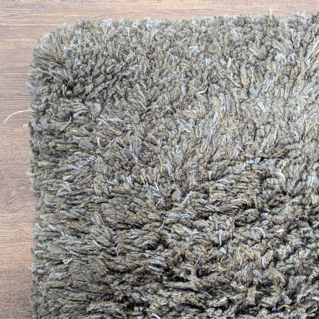 Neutral brown rug with a thick, fluffy pile, offering comfort and warmth for bedrooms or offices.