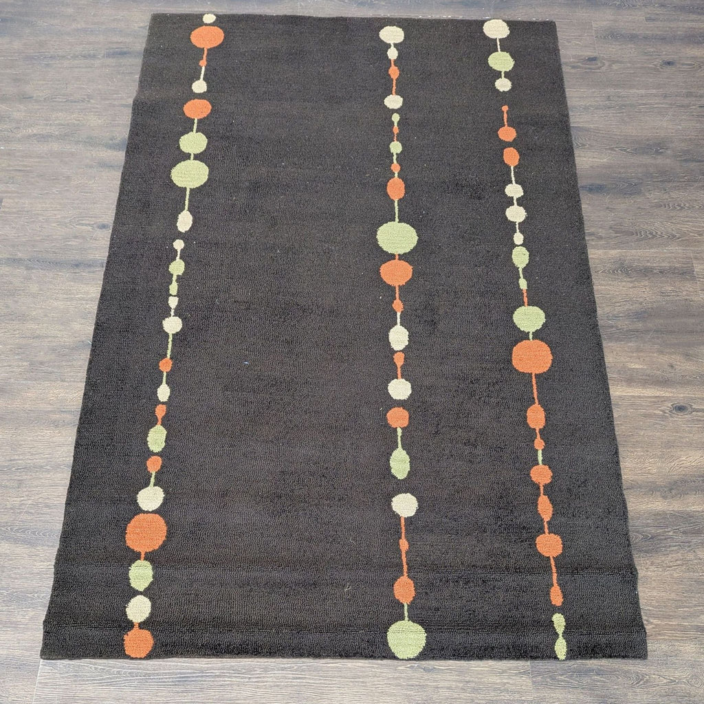 1. Modern rug with a brown base and rows of orange, green, and cream circles, perfect for stylish interiors.
