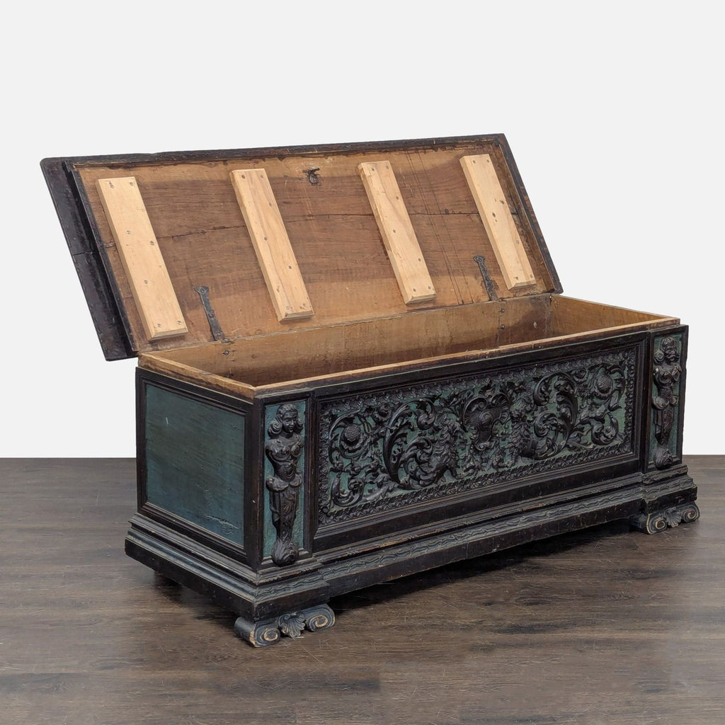 Decorative item with detailed carvings, corner figures, and preserved original metal hinges.
