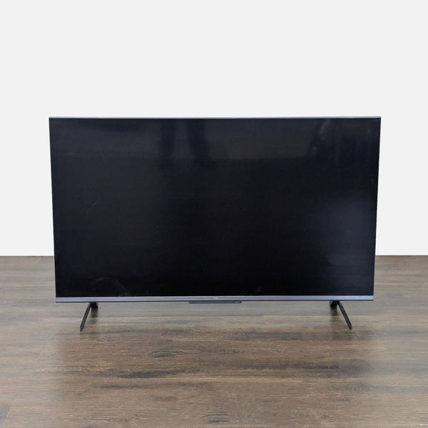 TCL 55-Inch 6-Series 4K Google TV with stand, slim design, and HDMI support displayed in great condition.  
