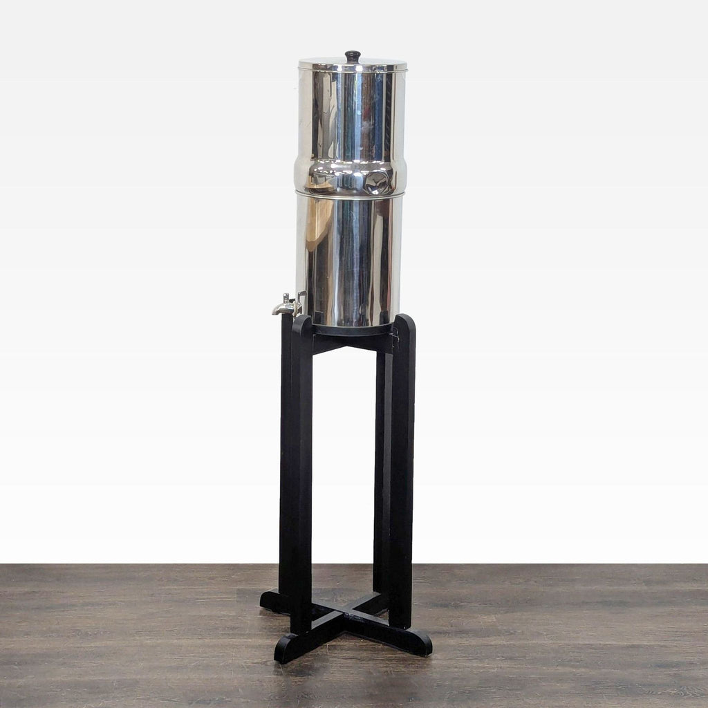 Stainless steel Berkey water purifier in excellent condition, suitable for home filtration.  