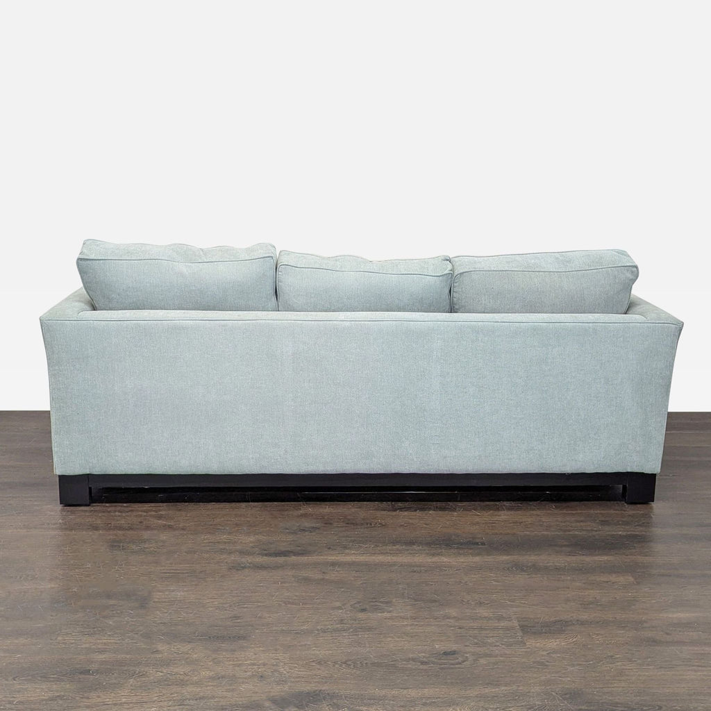 2. Jonathan Louis brand 3-seater couch featuring a sleek silhouette and spacious seating for comfort and style.