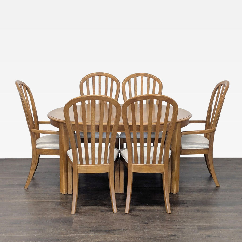 3. Stanley Furniture brand dining set displayed with table and chairs, ideal for contemporary eating areas.