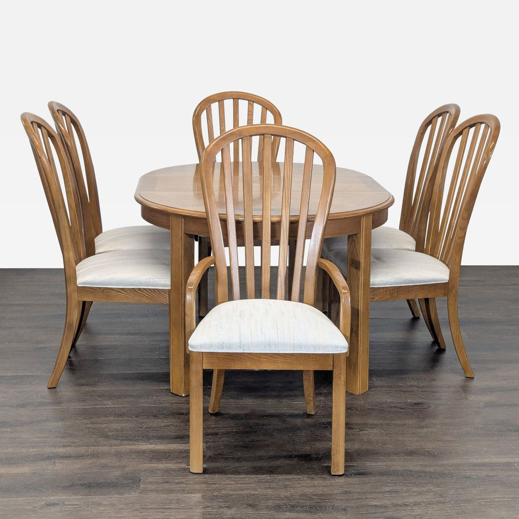1. Stanley Furniture dining set featuring a stylish table with matching chairs, perfect for elegant dining rooms.  