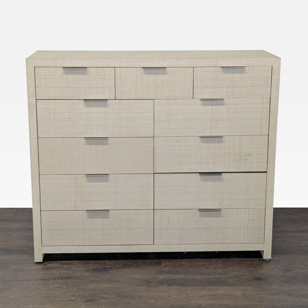 Restoration Hardware dresser with 11 drawers, light textured finish, and sleek metal handles for modern bedrooms.  