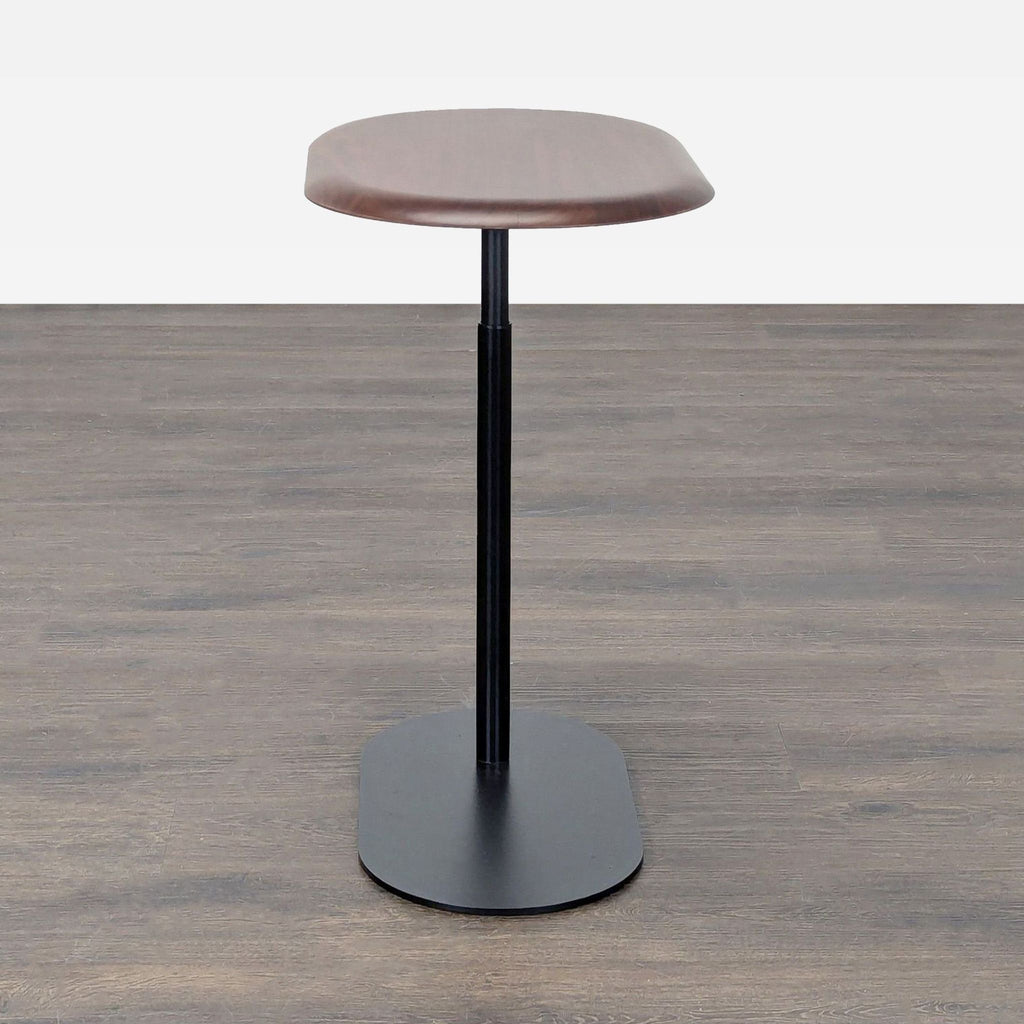 Article brand side table with height-adjustable wooden surface and sleek black metal base.