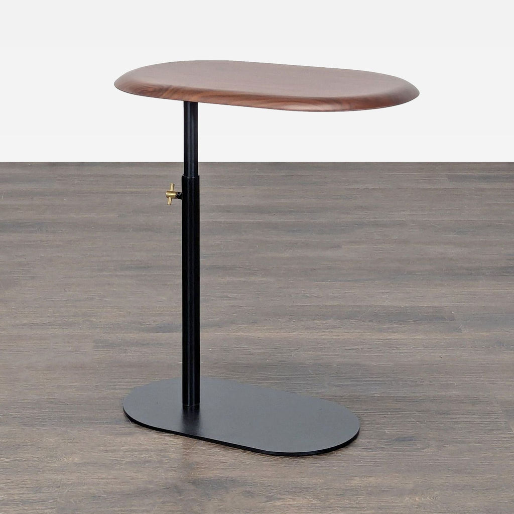 Modern Article console table featuring an adjustable wood top and sturdy steel base.  
