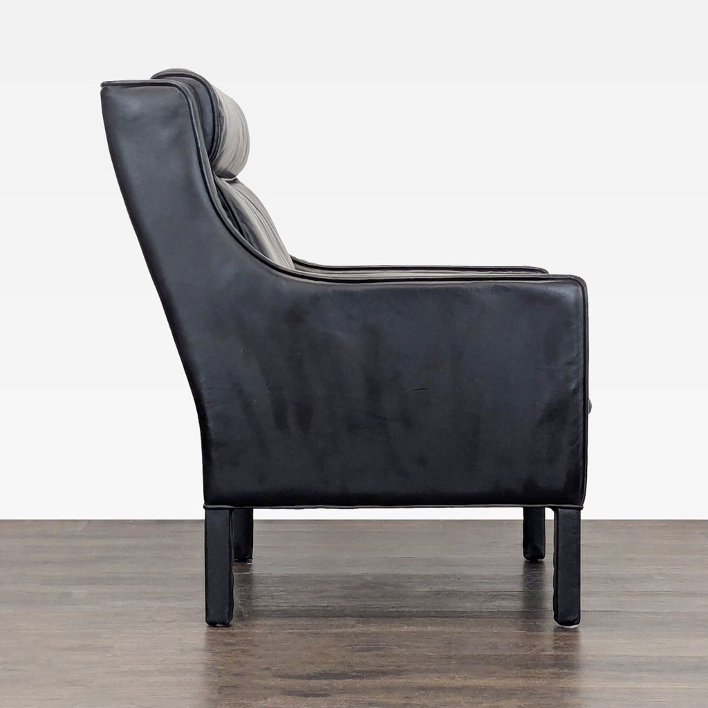 2. Side profile of a Restoration Hardware lounge seat, highlighting its plush upholstery.