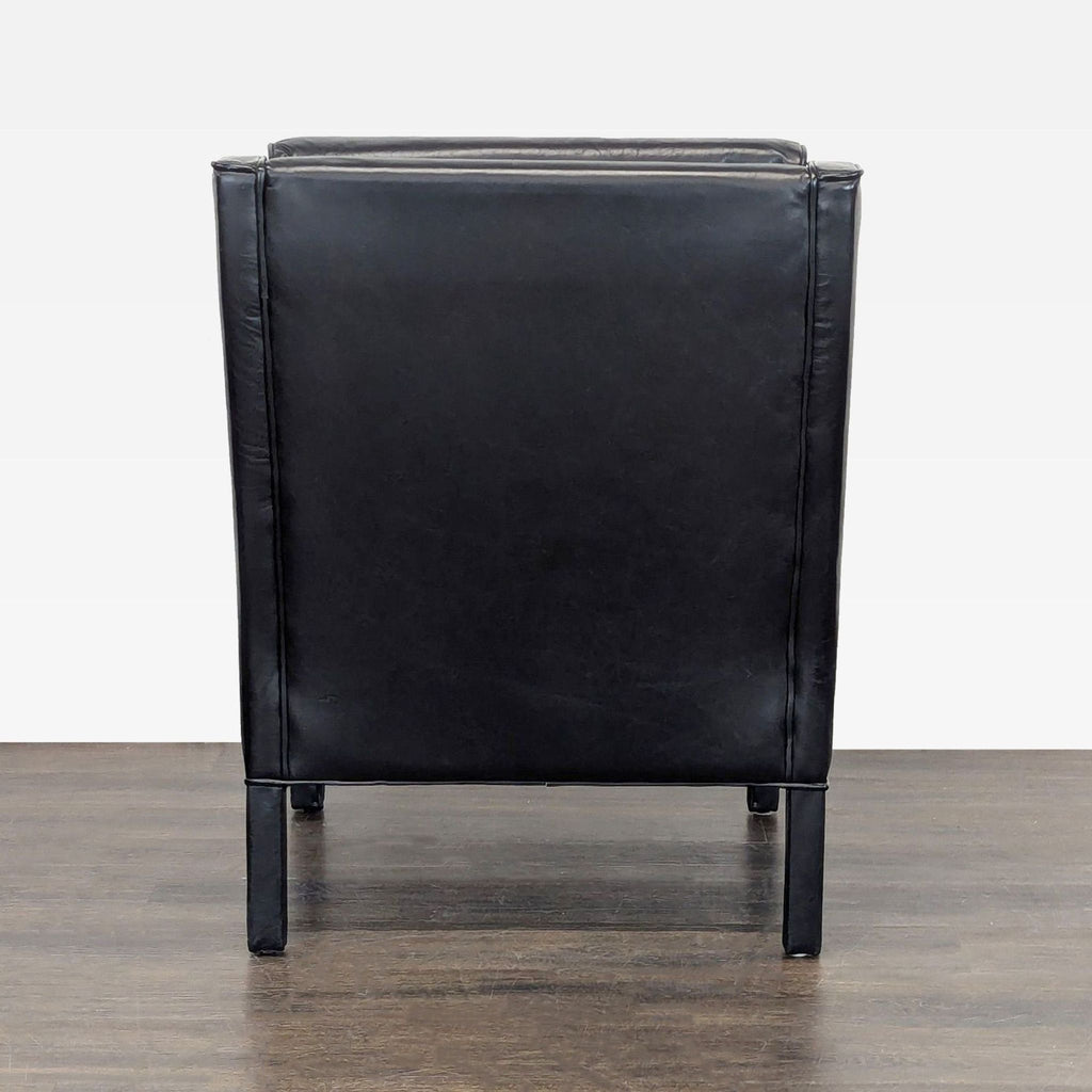 1. Restoration Hardware lounge chair with modern design, shown in a well-lit living room.