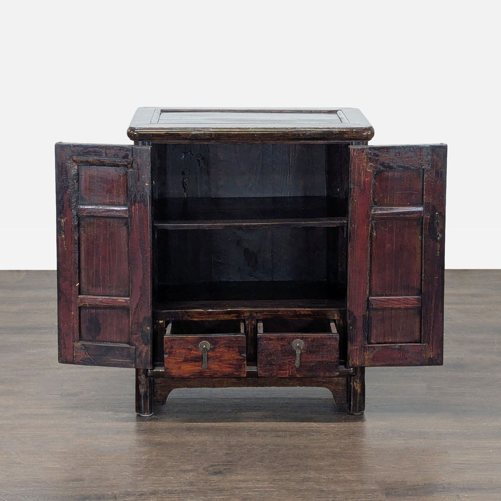 Dark wood cabinet with two doors, metal circular lock, internal shelving, and small drawers inside.