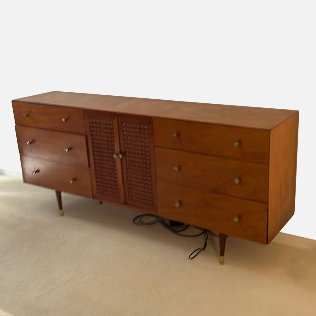 Classic wooden dresser with spacious drawers, central storage cabinet, and elegant brass-accented sturdy legs.