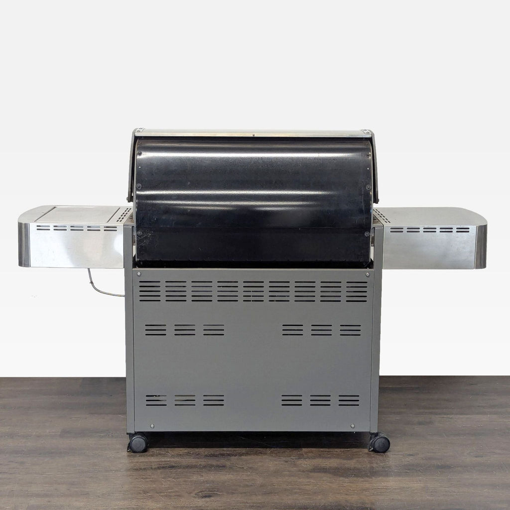 Weber outdoor grill in good condition with multiple burners, side burner, and lower cabinet for storage.