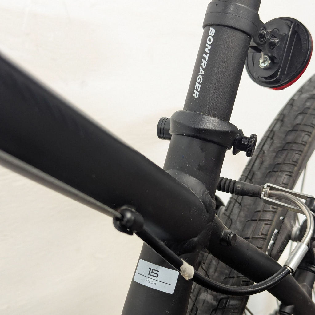 3. Close-up of Trek bike’s frame showing 15-inch size label and secure welded joints, with detailed cable routing.