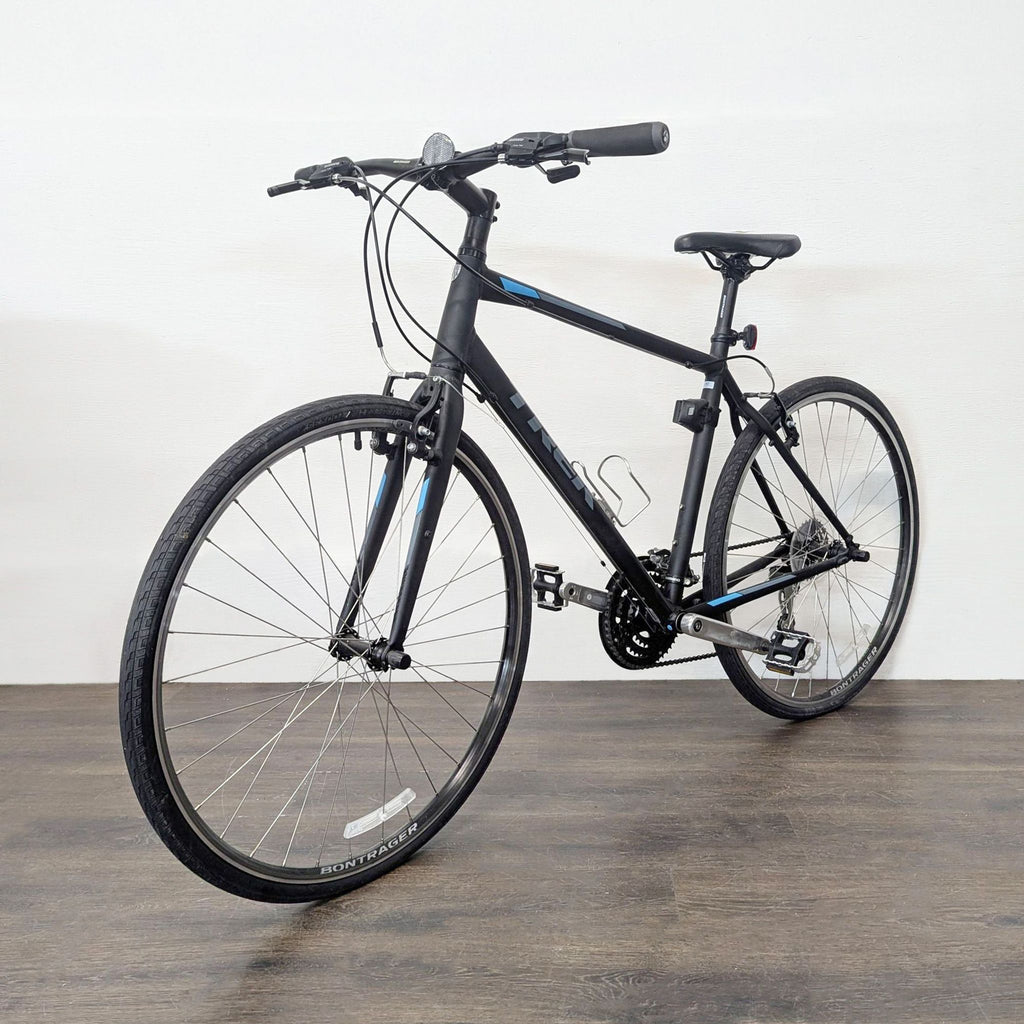 2. Angled view of Trek hybrid bike, showing reliable tires and components, perfect for urban outdoor equipment.  