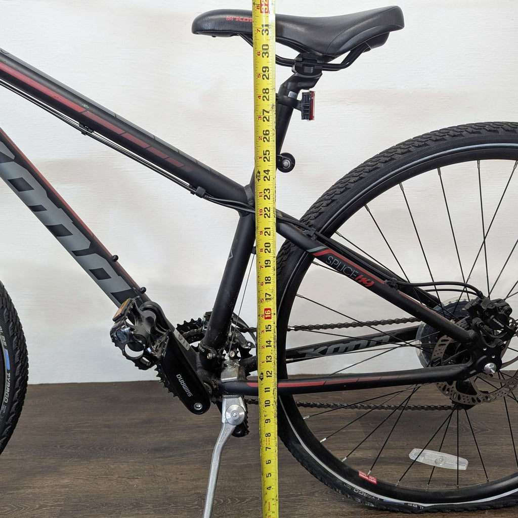 Sleek Kona hybrid bicycle featuring lightweight frame, comfortable saddle, and reliable disc brakes.  