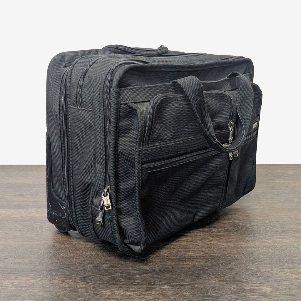 Tumi Black Rolling Carry-On Travel Bag with Telescopic Handle