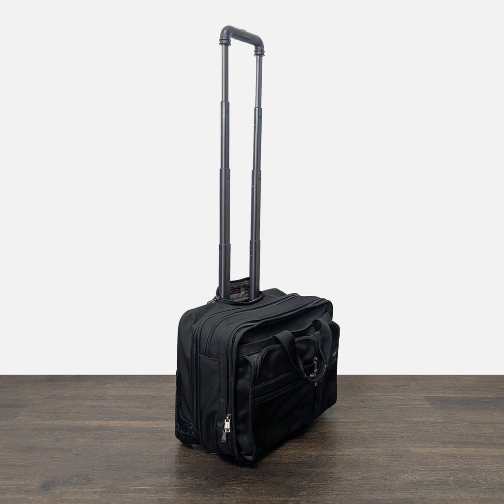 Tumi Black Rolling Carry-On Travel Bag with Telescopic Handle
