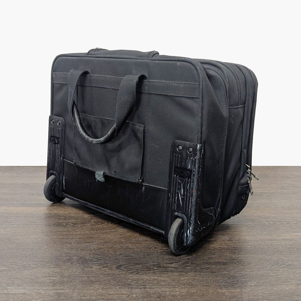 Tumi Black Rolling Carry-On Travel Bag with Telescopic Handle
