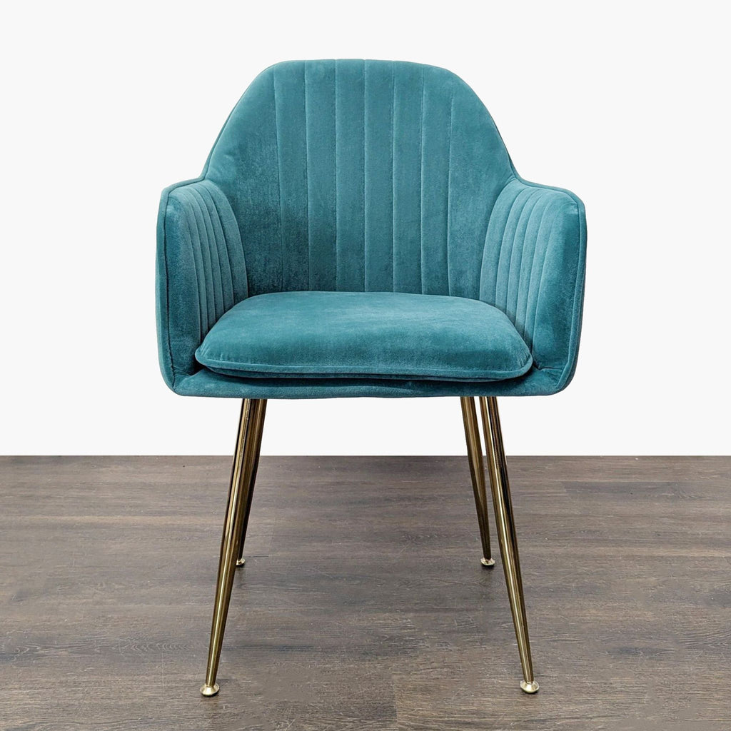 Teal velvet lounge chair with vertical stitching, padded armrests, and gold metal legs for a modern look.  