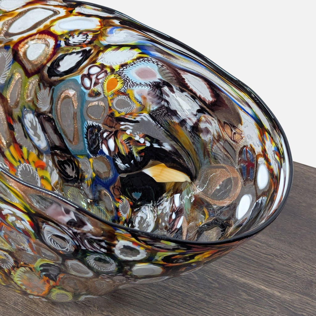 Colorful Venetian glass bowl featuring a thousand-flower Millefiori design and softly folding, wavy rim.