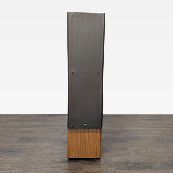 1. ADS floor standing stereo speaker with black grille and wood finish cabinet, shown upright on wood floor.