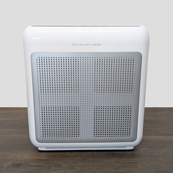 Coway Airmega air purifier with modern design, shown in a home setting, filters dust and odors quietly and efficiently.