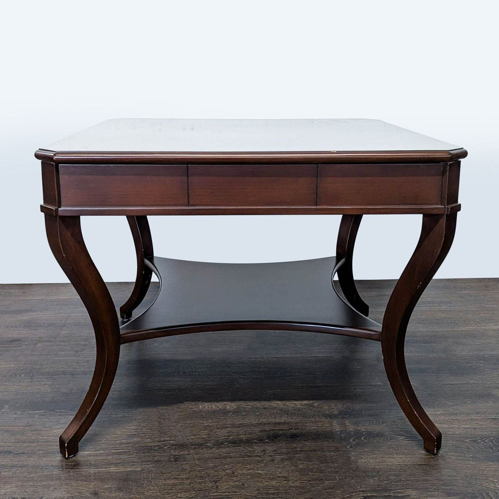 1. Dark wood side table with curved legs and a lower shelf, viewed from the front.