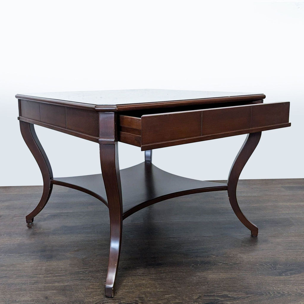 3. Square side table with flared legs and an open drawer, highlighting storage functionality.