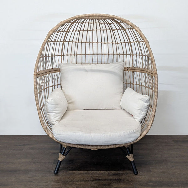 Opal House egg chair with a rattan-style frame and cream cushions, gently used and stylish for any room.  
